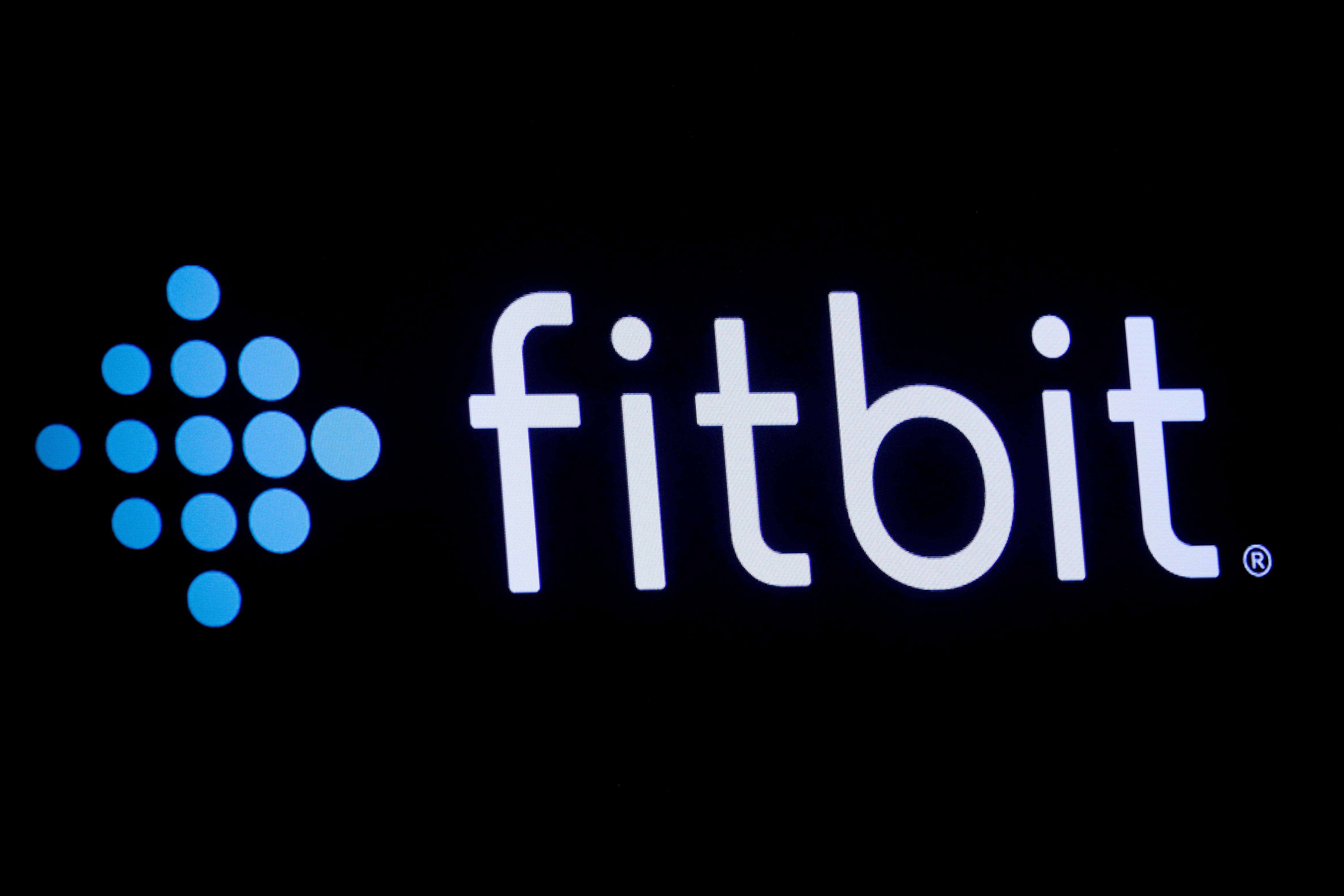 The logo for wearable device maker Fitbit Inc. is displayed on a screen at NYSE floor in New York (Photo: REUTERS/Brendan McDermid)