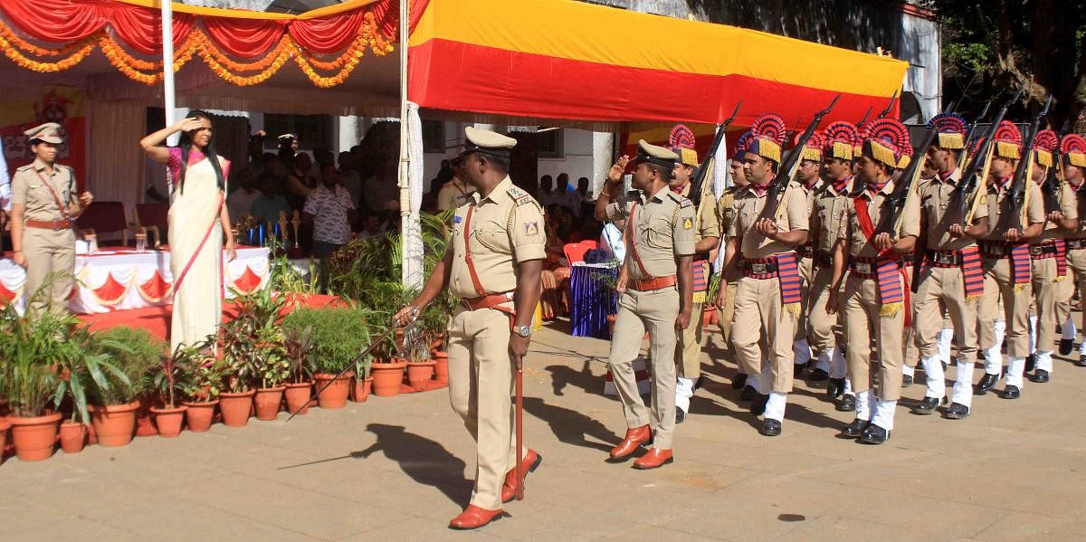 Deputy Commissioner Annies Kanmani Joy receives guard of honour from Police Squad during Karnataka Rajyotsava celebrations in Madikeri on Friday.
