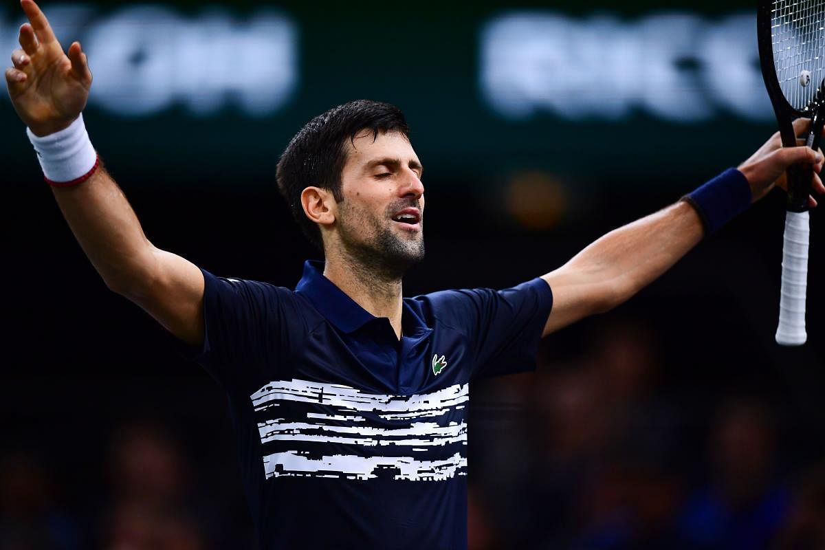 Serbia's Novak Djokovic celebrates winning a point against Bulgaria's Grigor Dimitrov during their men's singles semi-final tennis match at the ATP World Tour Masters 1000 - Rolex Paris Masters - indoor tennis tournament at The AccorHotels Arena in Paris on November 2, 2019. AFP