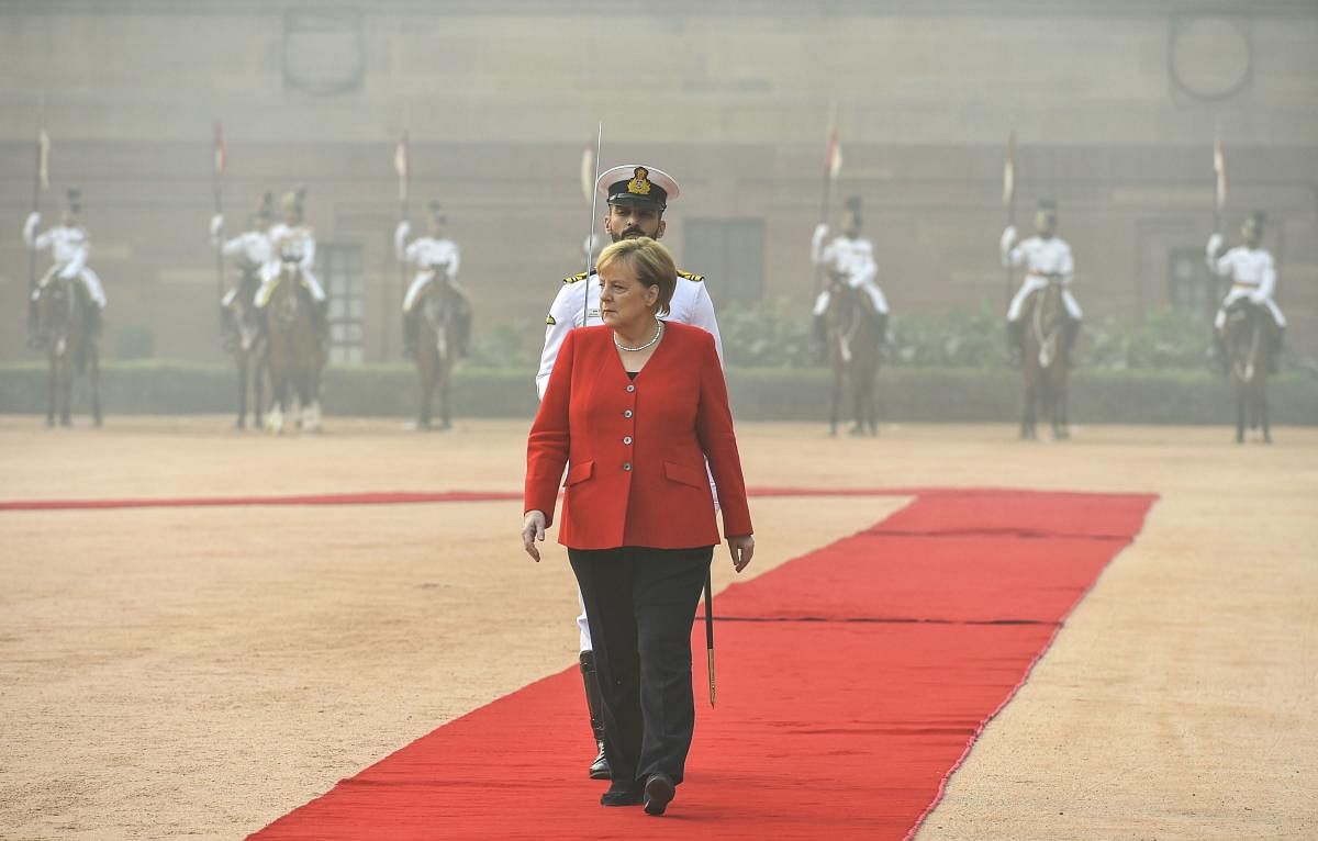 Merkel said that Germany would spend one billion euros on "green" urban transport projects in India over the next five years, including 200 million euros to replace diesel buses in Tamil Nadu state. Photo/PTI