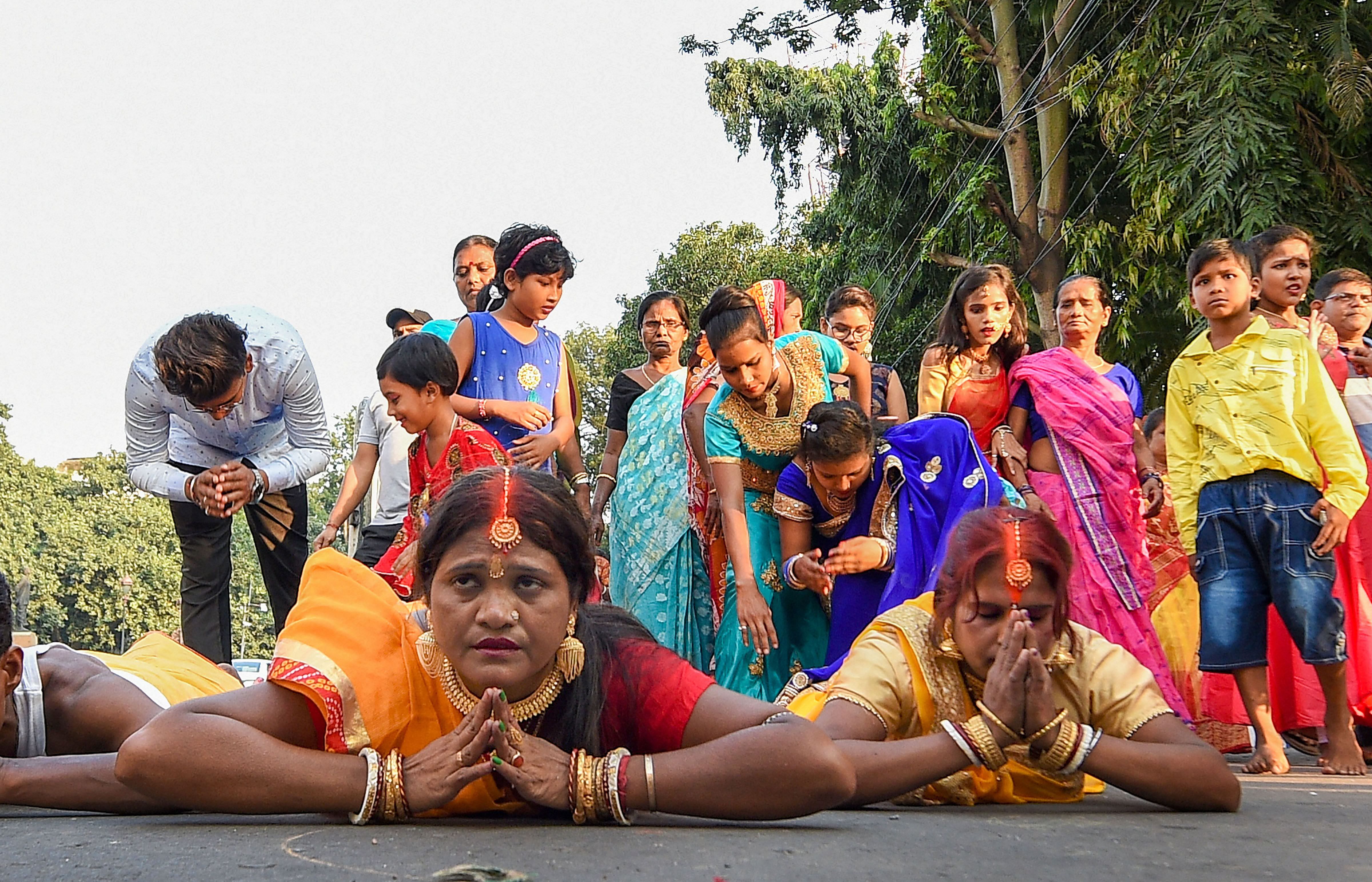  Devotees perform Chhath Puja at River Ganga in Kolkata. (PTI Photo)