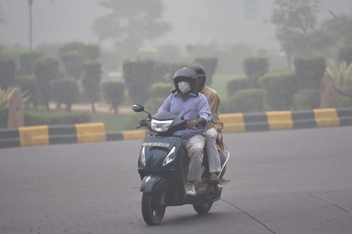  A motorcyclist rides through thick smog, in New Delhi, Sunday, Nov. 3, 2019. Delhi was enveloped in a thick layer of smog on Sunday morning with the minimum temperature settling at 18.7 degrees Celsius, four notches above the season's average. PTI