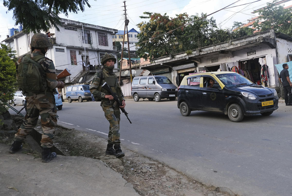 Soldiers stand guard on a street in Kohima, capital of the northeastern Indian state of Nagaland (PTI Photo)