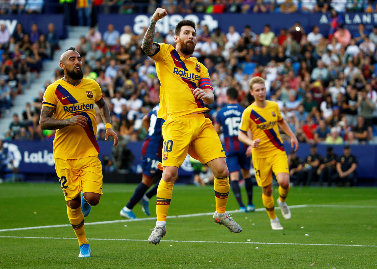  Barcelona's Lionel Messi celebrates scoring their first goal from the penalty spot (Reuters Photo)