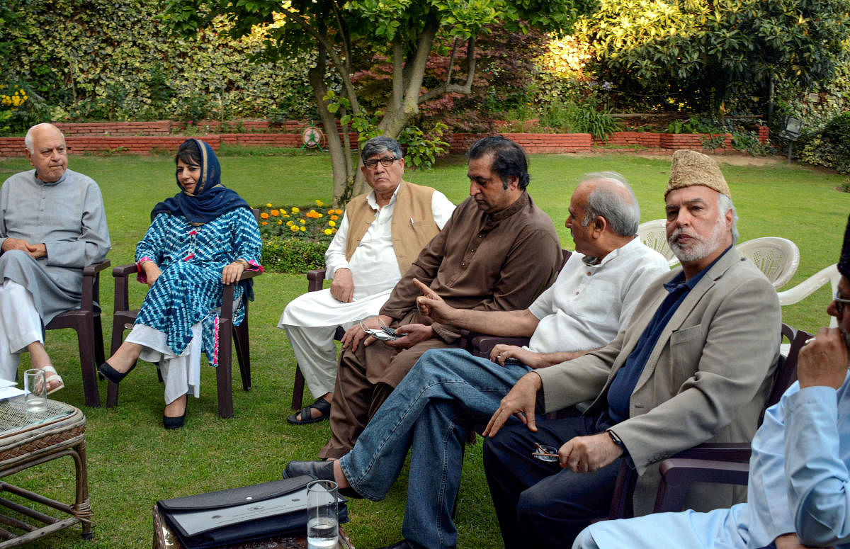 National Conference President Farooq Abdullah, PDP President and former chief minister Mehbooba Mufti and other leaders during an all party meeting regarding the current situation in Kashmir, in Srinagar. (PTI Photo)