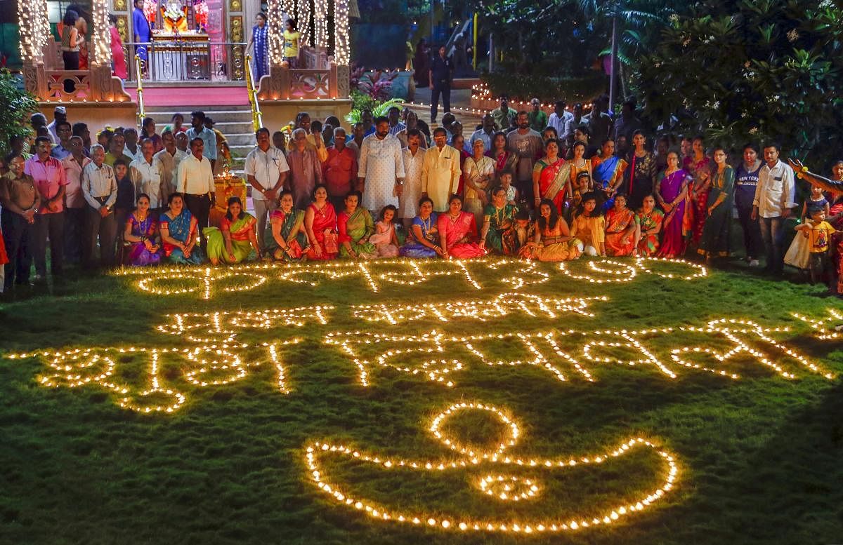 People light lamps to celebrate new Hindu calendar year (first day of Vikram Samvat 2076) in Thane, Monday night, Oct. 28, 2019. (PTI Photo)