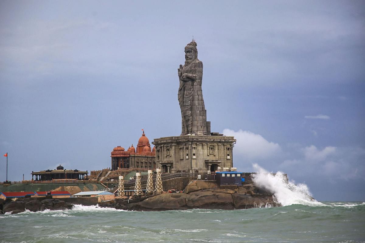 Sea waves break against the 133-ft tall Thiruvalluvar statue in Kanyakumari district of Tamil Nadu. (PTI Photo)