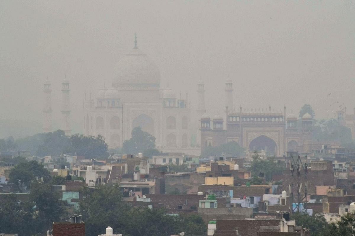 A view of Agra city with the Taj Mahal shrouded in smog. PTI