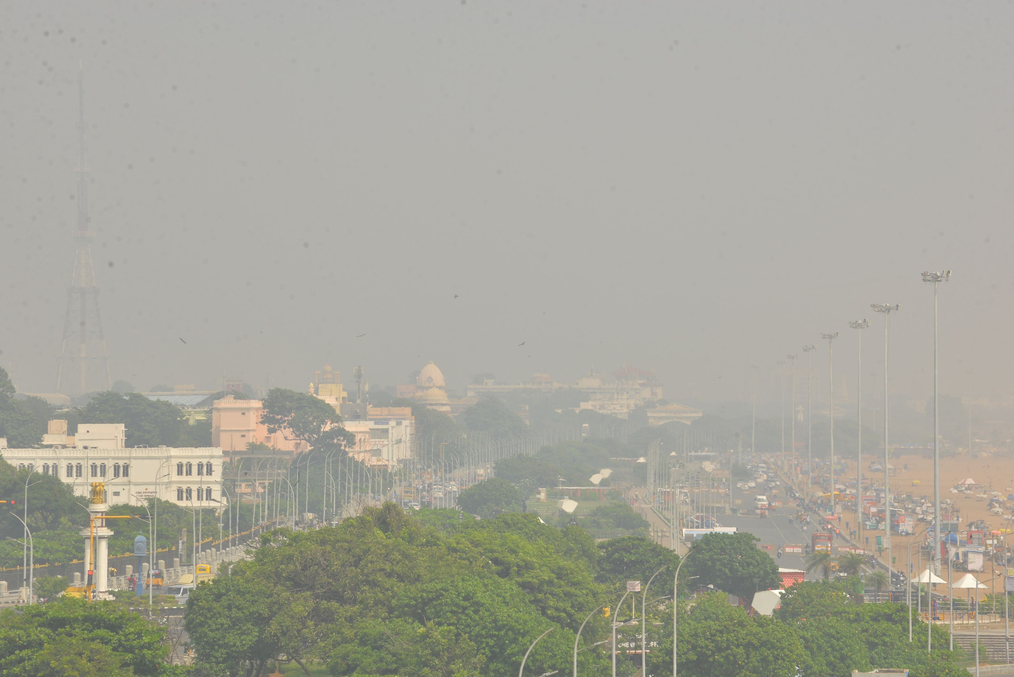 The Marina Beach being covered under smog on Monday. (DH photo)