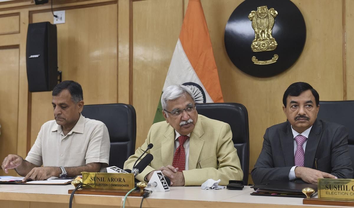 Chief Election Commissioner Sunil Arora flanked by Election Commissioners Ashok Lavasa (L) and Sunil Chandra during a press conference regarding Maharashtra and Haryana Assembly Elections, at Election Commission in New Delhi. (PTI Photo)
