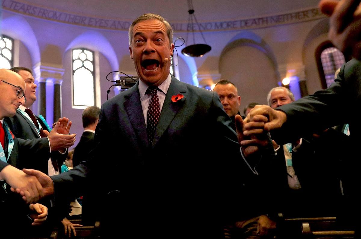 Brexit Party leader Nigel Farage (C) arrives to speak at an event to introduce the party's Prospective Parliamentary Candidates (PPC) for the 2019 general election in London on November 4, 2019. - Britain goes to the polls on December 12 to vote in a pre-Christmas general election. (Photo by AFP)
