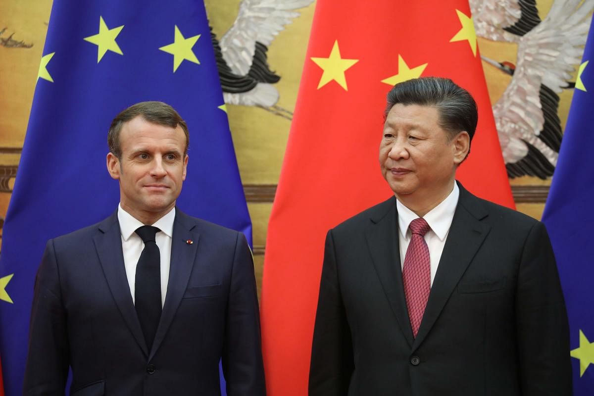 French President Emmanuel Macron (L) attends a signing ceremony with Chinese President Xi Jinping at the Great Hall of the People in Beijing on November 6, 2019. (Photo by LUDOVIC MARIN / AFP)