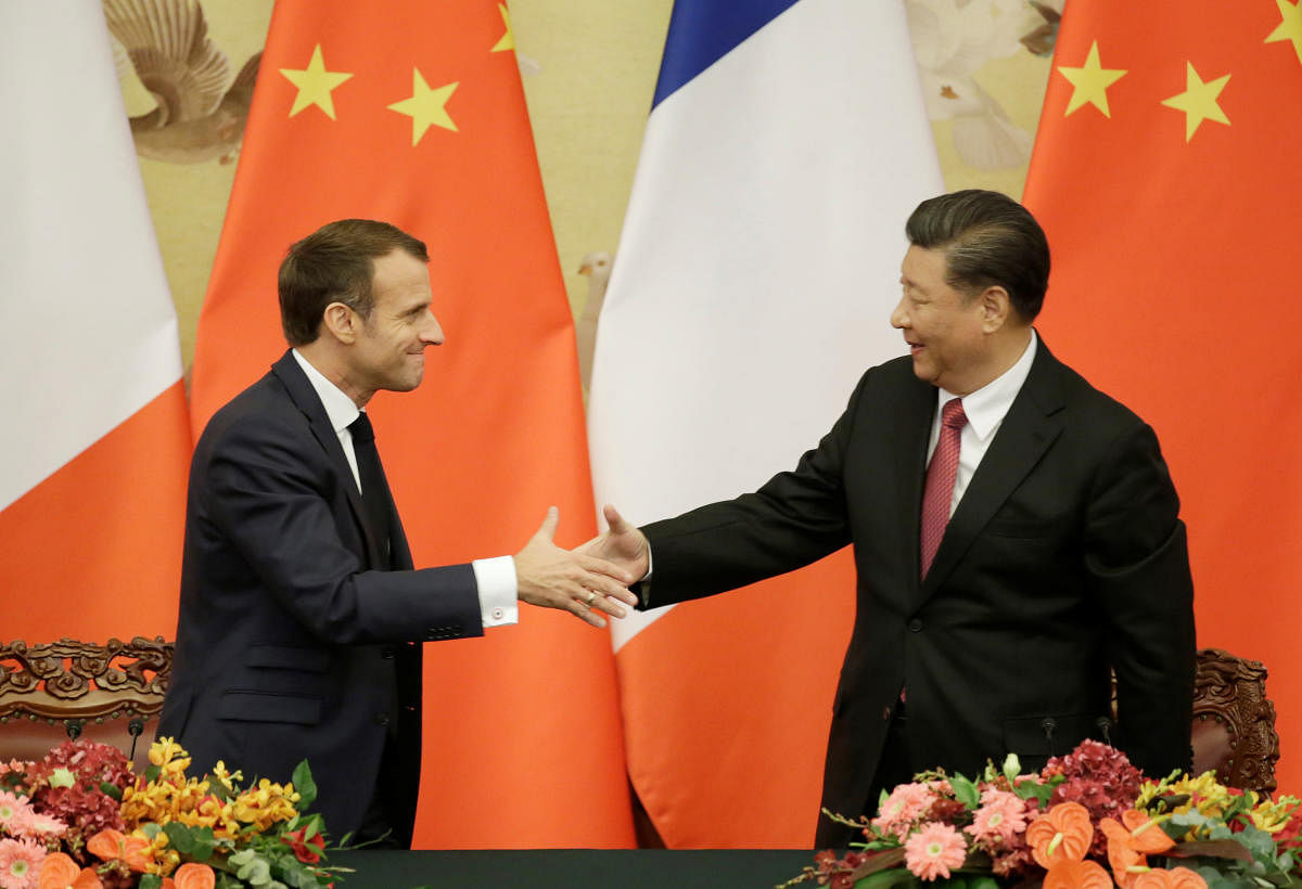 French President Emmanuel Macron shakes hands with China's President Xi Jinping after a joint news conference at the Great Hall of the People in Beijing, China November 6, 2019. (Reuters photo)