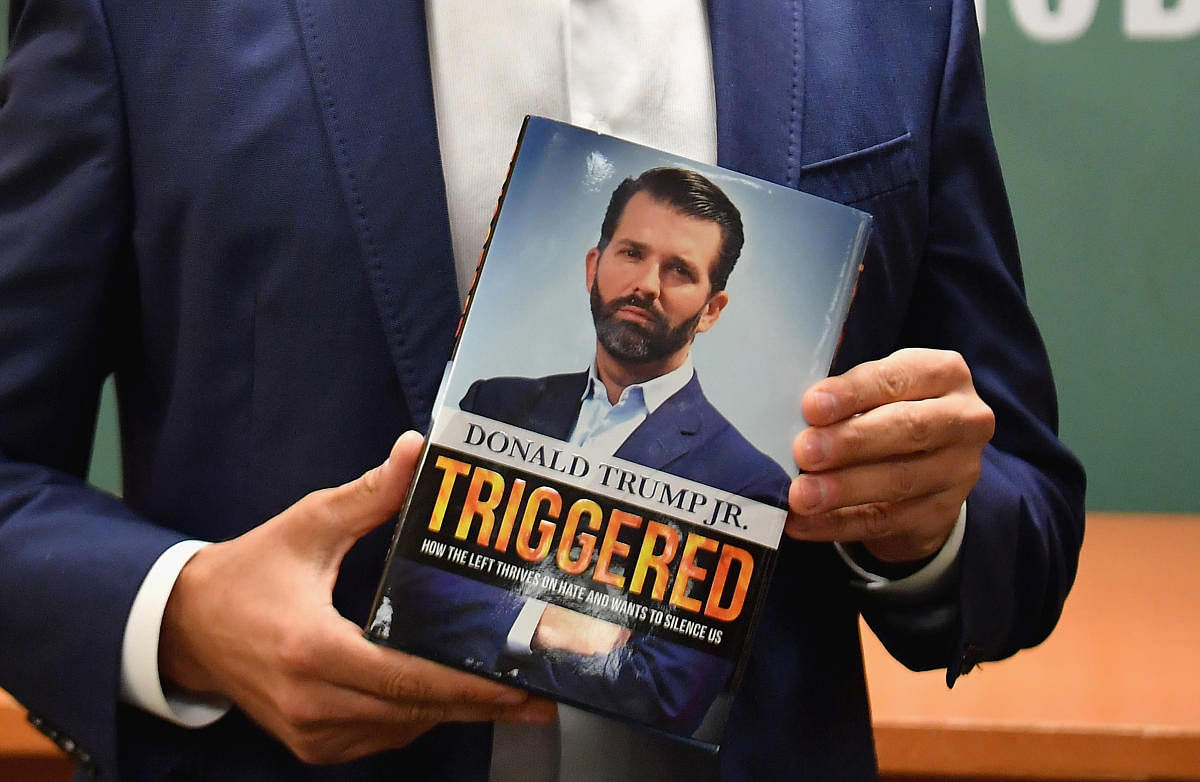 Donald Trump Jr., holds his new Book "Triggered: How the Left Thrives on Hate and Wants to Silence Us" at Barnes & Noble on 5th Avenue on November 5, 2019 in New York. (Photo by Angela Weiss / AFP)