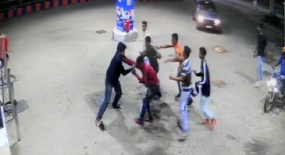 The CCTV video grab which shows the youth assaulting petrol bunk personnel in Baichanahalli on Monday night.