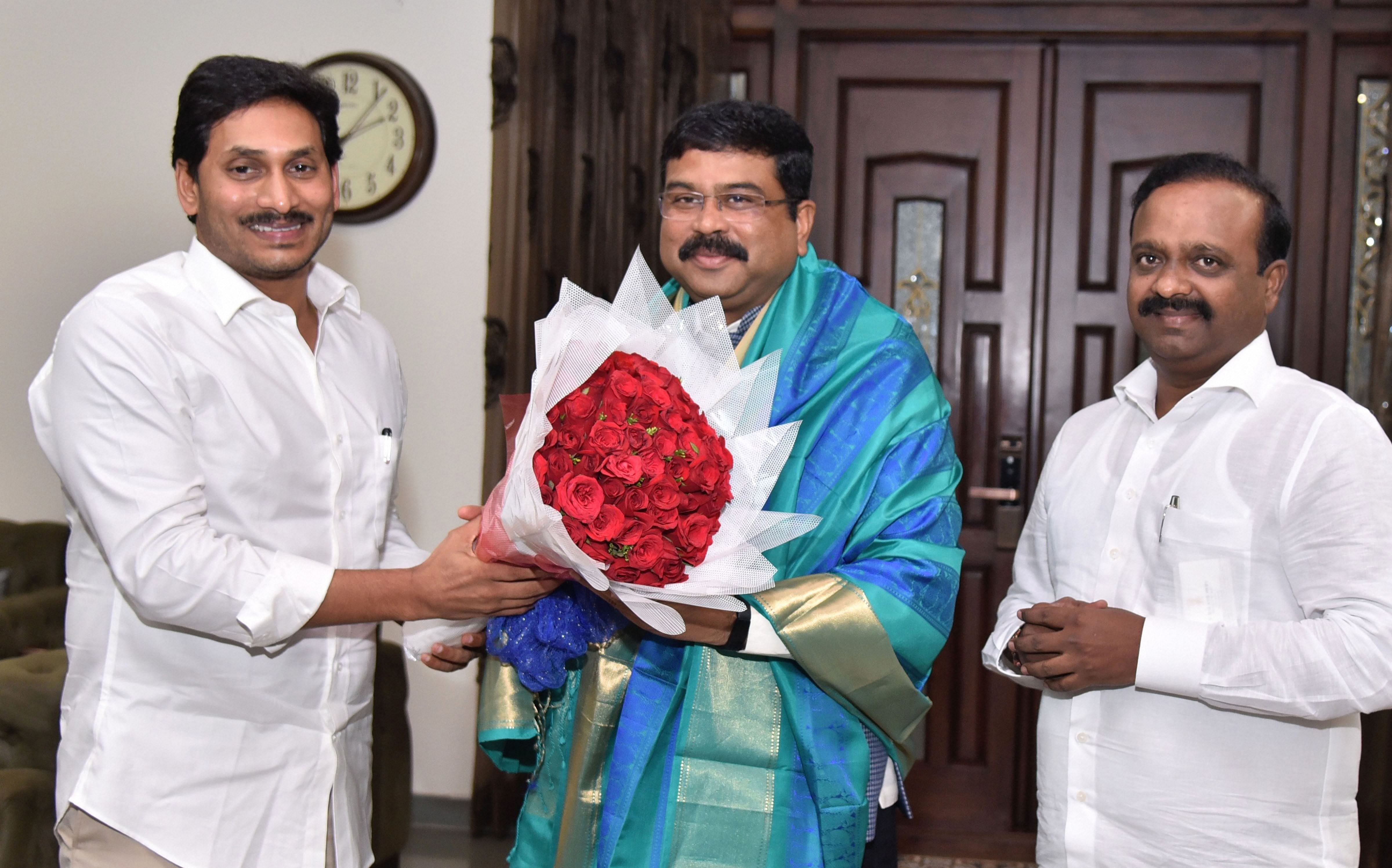 Union Petroleum and Natural Gas Minister Dharmendra Pradhan being presented with a bouquet by Andhra Pradesh Chief Minister YS Jaganmohan Reddy during a meeting, in Guntur (PTI Photo)