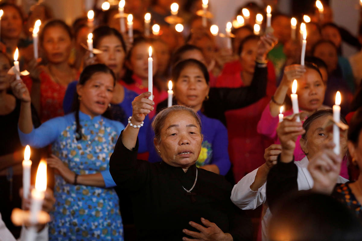 People in Vietnam praying for 39 people found dead in the back of a truck near London. (Reuters file photo)