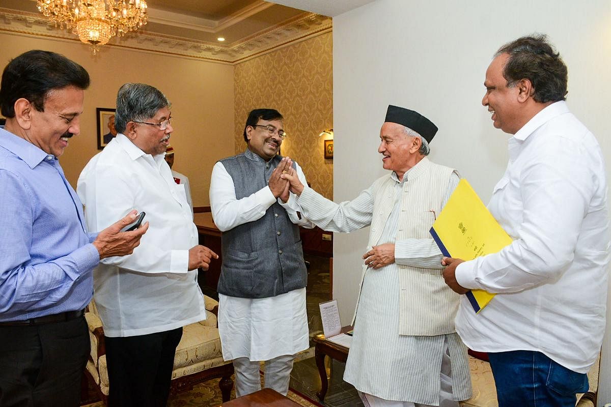 Maharashtra Governor Bhagat Singh Koshyari (right) meets ministers Chandrakant Patil (left) and Sudhir Mungantiwar at the Raj Bhavan in Mumbai on Thursday. PTI