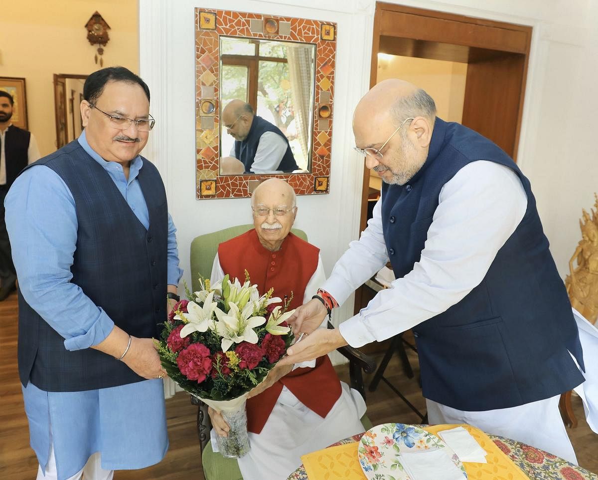 Senior BJP leader LK Advani being greeted by party President Amit Shah and Working President JP Nadda (PTI Photo)
