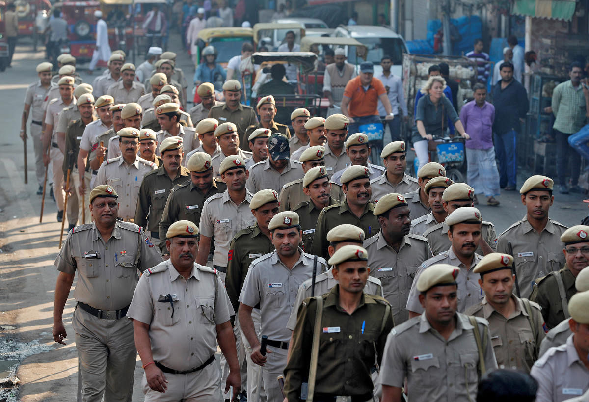 Police officers conduct a flag march in a street outside Jama Masjid, before Supreme Court's verdict on a disputed religious site claimed by both majority Hindus and Muslim in Ayodhya, in the old quarters of Delhi, India, November 9, 2019. (Reuters photo)