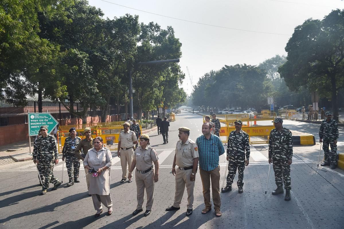 Police personnel stand guard outside the Supreme Court, in New Delhi, Saturday, Nov. 9, 2019. Security around the apex court has been beefed up ahead of Ayodhya verdict. (PTI Photo/Manvender Vashist)