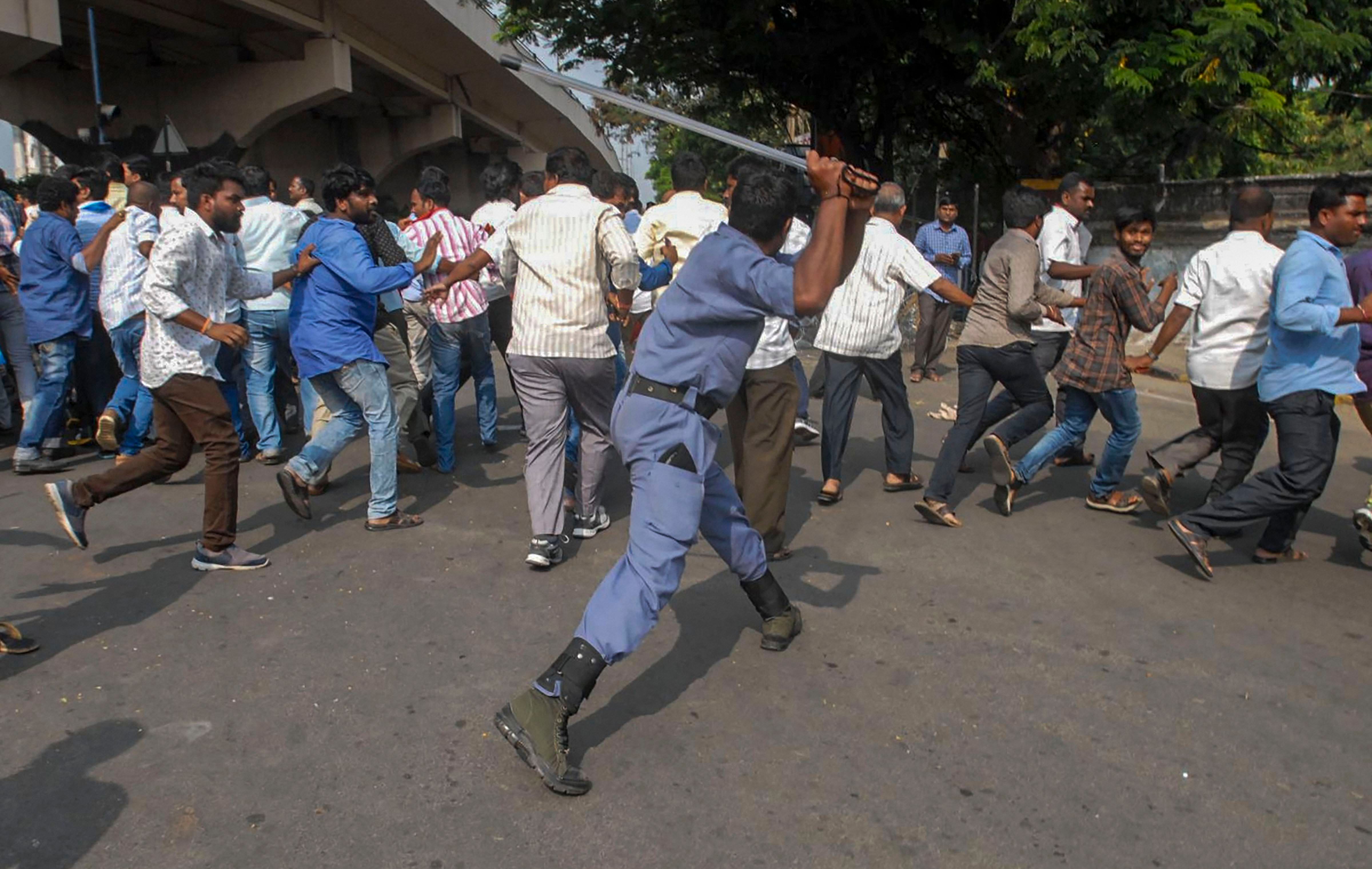 Police personnel baton charge protestors during a demonstration, in Hyderabad. (PTI Photo)