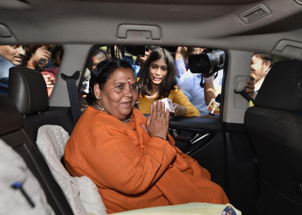 Senior BJP leader Uma Bharti leaves after meeting party veteran LK Advani at his residence, in New Delhi, Saturday, Nov. 9, 2019. (PTI Photo)