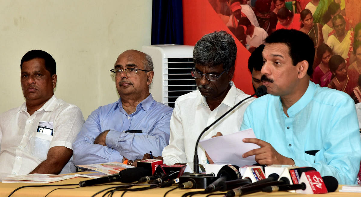 MP and BJP state president Nalin Kumar Kateel speaks at a press conference at BJP district office in Mangaluru. Minister Kota Srinivas Poojary and former MLA Yogish Bhat look on.