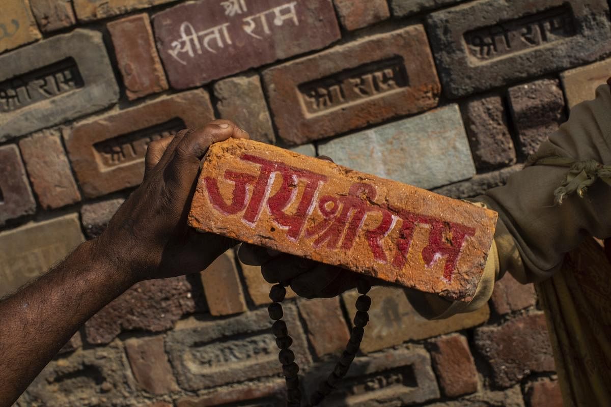 Brick reading "Jai Shree Ram" as bricks of the old Babri Mosque are piled up in Ayodhya (AP Photo)