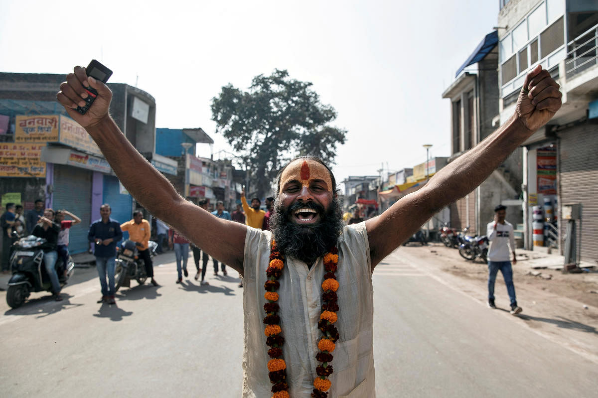A Sadhu or a Hindu holy man celebrates after Supreme Court's verdict on a disputed religious site, in Ayodhya, India, November 9, 2019. (Reuters photo)