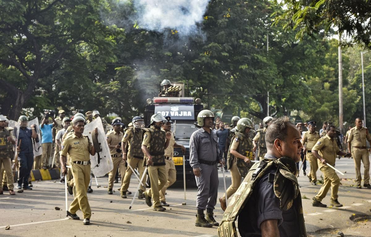 Security personnel lathi charge protesting TSRTC employees at Tankbund, in Hyderabad.(PTI Photo)