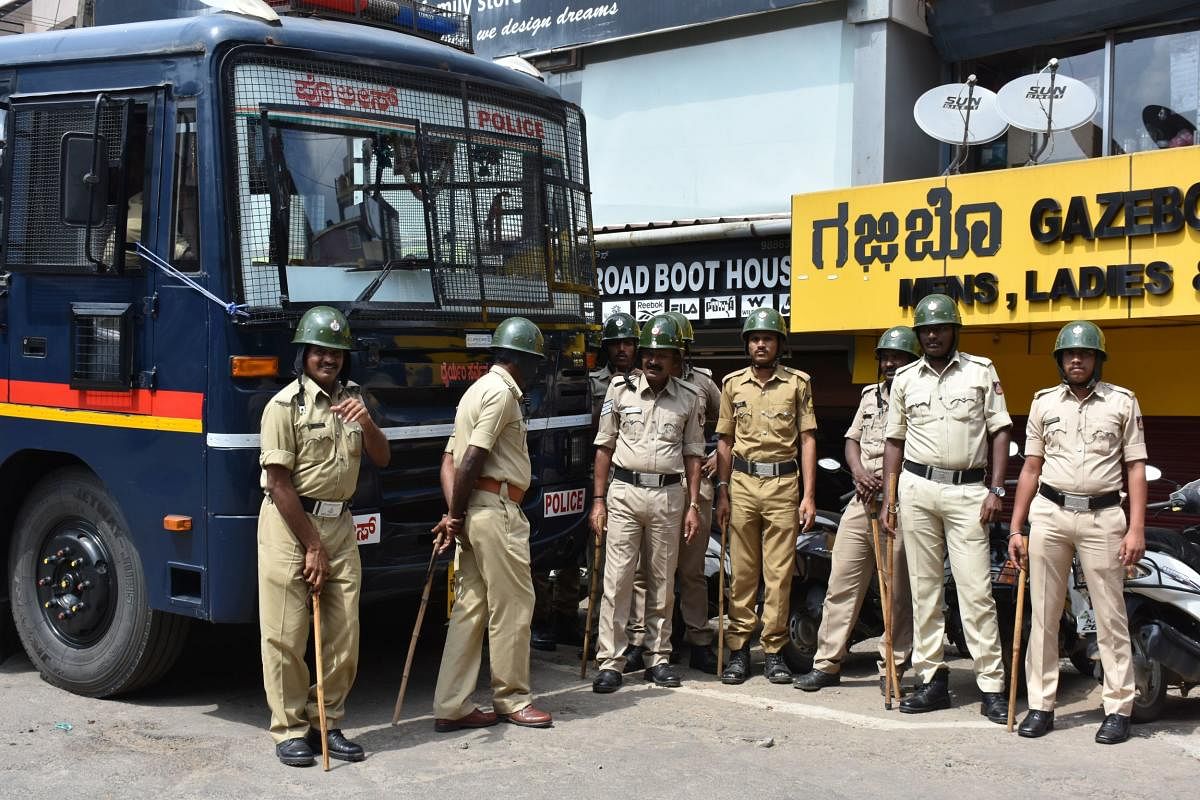 Police personnel deployed at Indira Gandhi Circle, in Madikeri on Saturday. dh photo