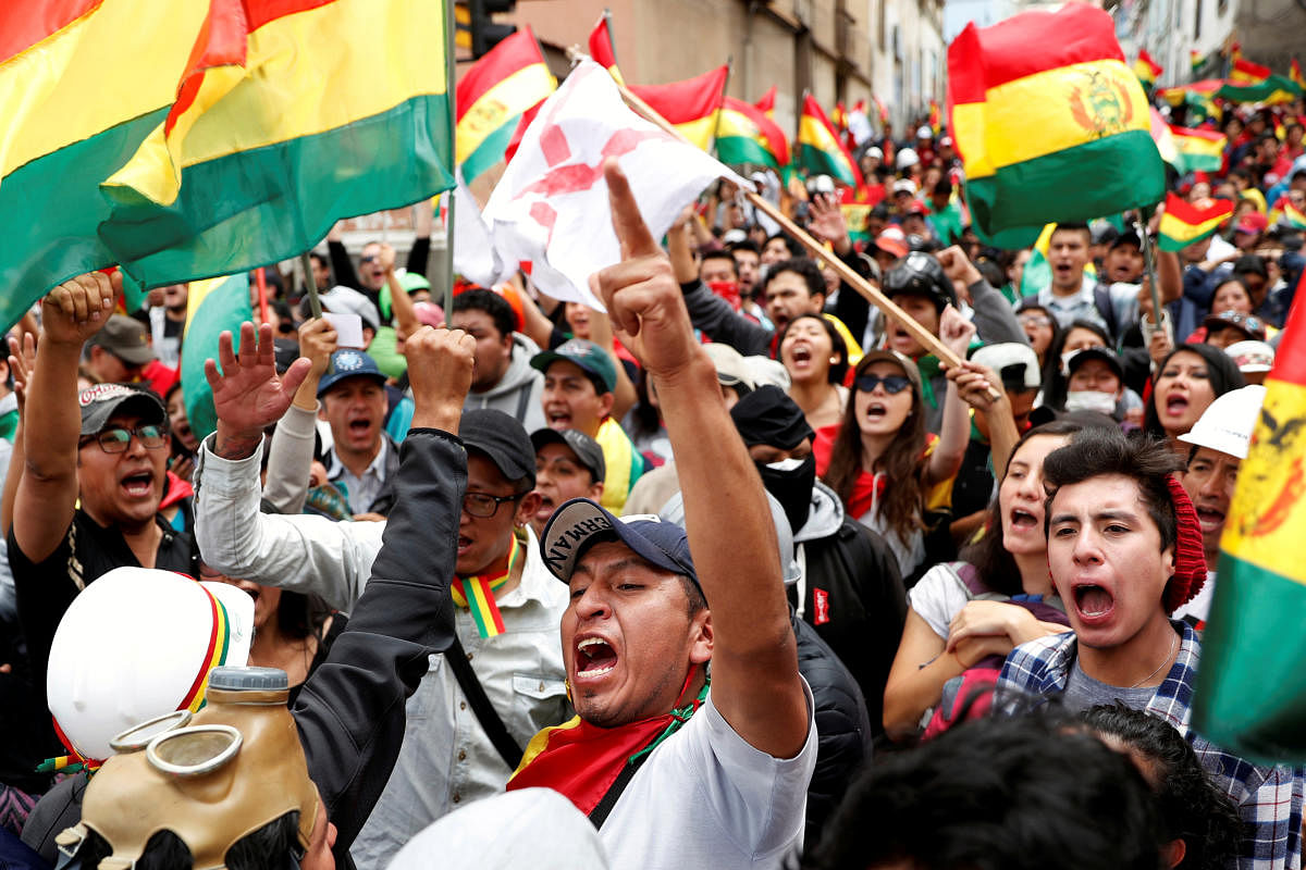 People shout slogans during a protest against Bolivia's President Evo Morales in La Paz (Reuters Photo)