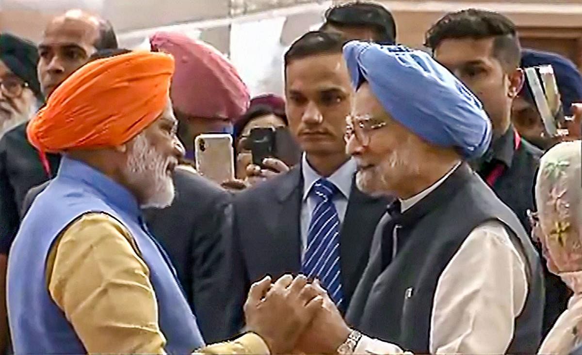 Prime Minister Narendra Modi greets former prime minister Manmohan Singh during an event to inaugurate the passenger terminal building of the Kartarpur corridor (PTI Photo)
