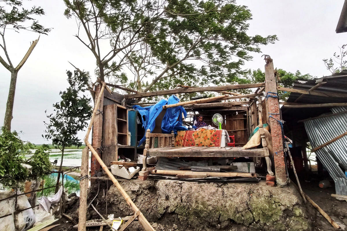 A woman is seen inside her damaged house after cyclone Bulbul hit the area in Khulna, Bangladesh, November 10, 2019.  (Reuters photo)