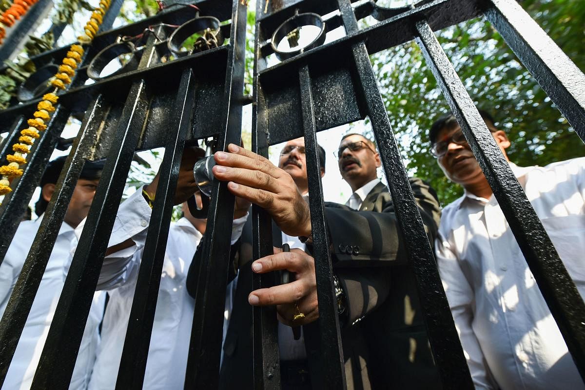 Advocates place a lock on the gate of Patiala Court during a protest over last week's incident of clashes between lawyers and police, in New Delhi, Wednesday, Nov. 6, 2019. (PTI Photo)