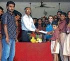 Noble Deed Students of Sri Pragathi School handing over a demnad draft for Rs 50,000 to tahsildar Hanumantharaya