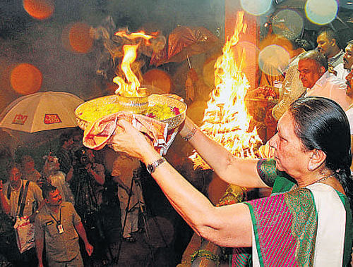 Gujarat Chief Minister performs aarti on the banks of River Sabarmati on Tuesday. PTI