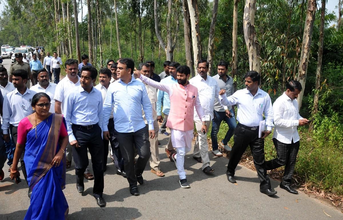 Deputy Chief Minister Dr C N Ashwath Narayan inspects the land identified for the construction of Medical college building at Kadrimidri in Chikkamagaluru.