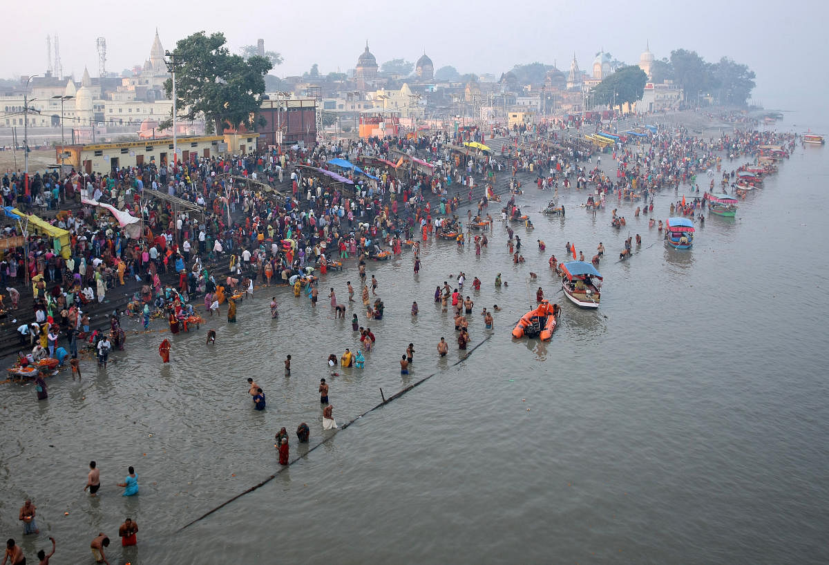 Hindu devotees gather to take a holy dip in the Sarayu river during the Kartik Poornima festival in Ayodhya. (Reuters Photo)