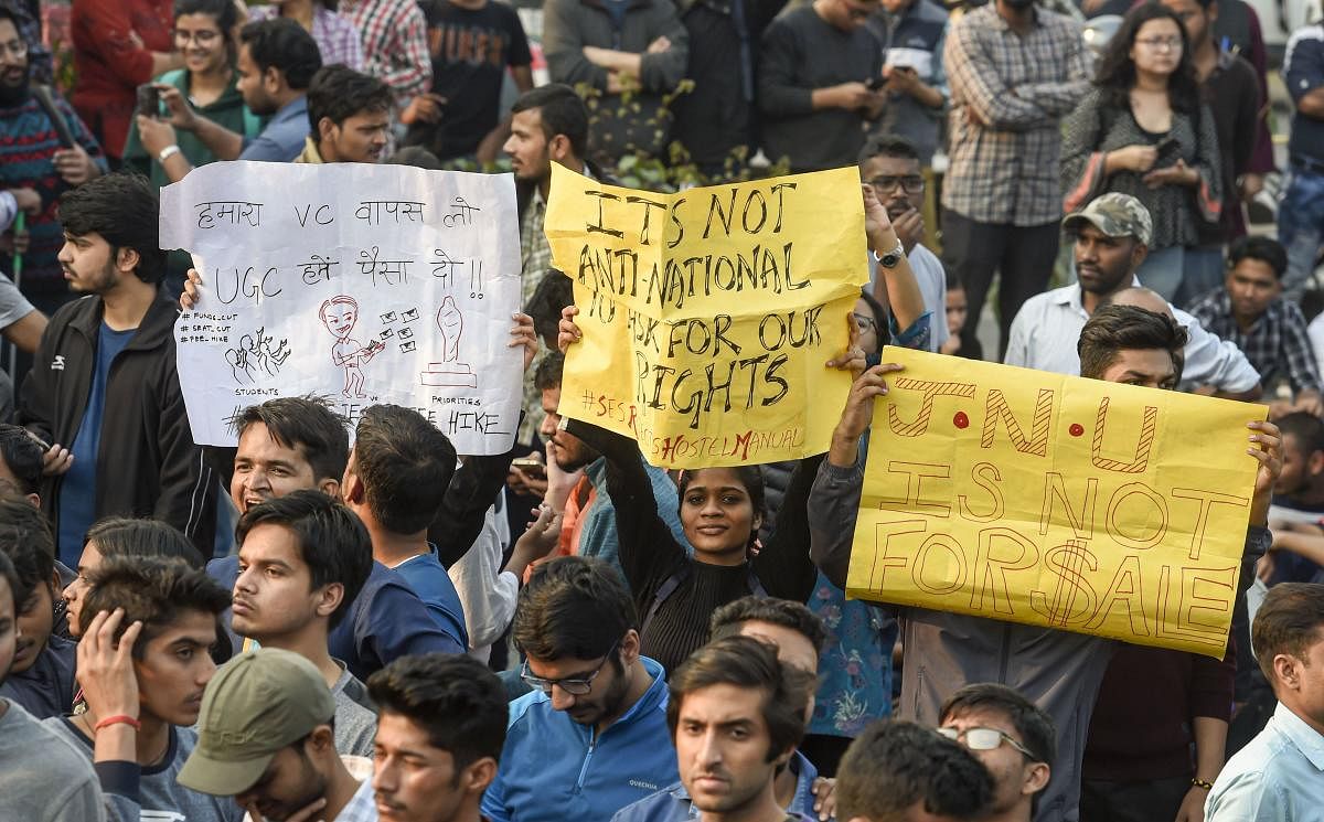 The students protested for close to nine hours and the air resonated with slogans of "Humein chahiye Azaadi curfew se, dress code se" to the thumping of dhaplis. Photo/PTI
