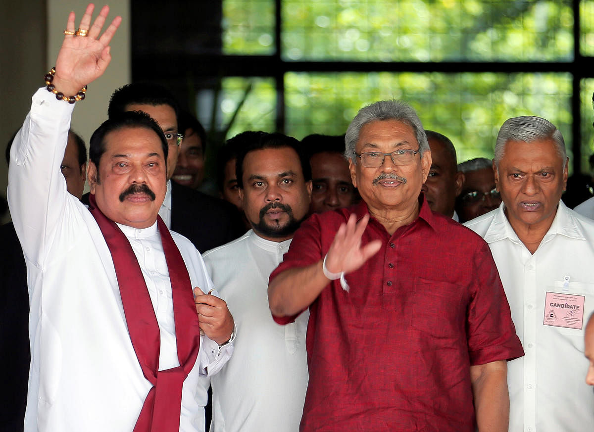 Gotabaya Rajapaksa, Sri Lanka People's Front party presidential election candidate and former wartime defence chief, with his brothers, Mahinda Rajapaksa, former president and opposition leader and Chamal Rajapaksa (R) are seen as they leave after handing over nomination papers at the election commission ahead of Sri Lanka's presidential election, scheduled for November 16 in Colombo, Sri Lanka October 7, 2019. Picture taken October 7, 2019. REUTERS/Dinuka Liyanawatte
