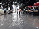 DOWNPOUR: A road clogged in Vivekanagar due to heavy rains that lashed the City on  Thursday evening. DH Photo