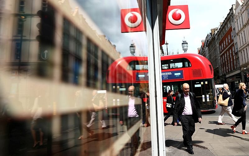 A branded sign is displayed on a Vodafone store in London, Britain. (Reuters Photo)