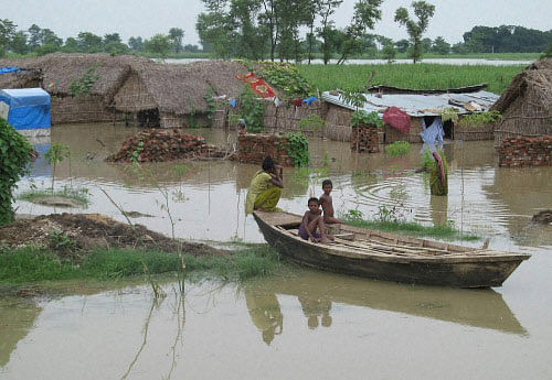 The toll in flood-related incidents in different parts of Uttar Pradesh inched closer to 100 as the situation continued to remain grim in several eastern and central districts though the water levels of some rivers started receding. PTI photo