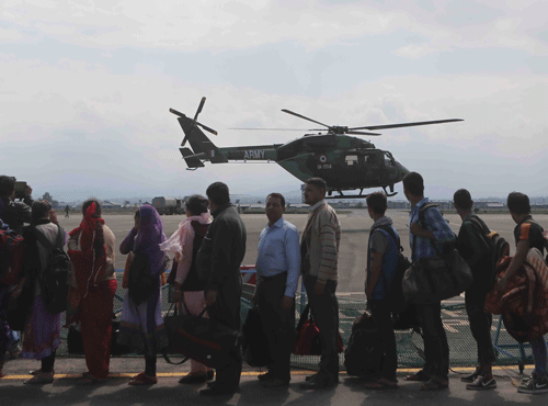 Tourists who were rescued by the army from the flooded areas wait to be transported to Jammu at an air force base in Srinagar, India, Monday, Sept. 8, 2014. Six days of rains in Indian Kashmir have left more than 120 people dead in the region's worst flooding in more than five decades, submerging hundreds of villages and triggering landslides, officials said. AP Photo