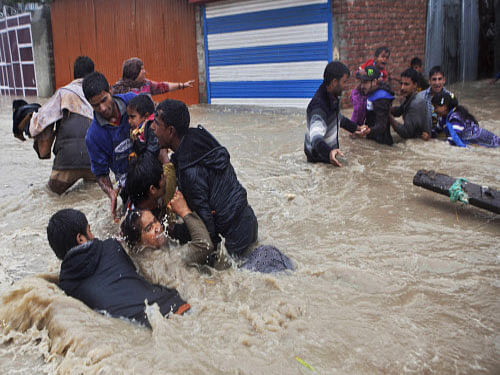 Flood waters continued to play havoc in Srinagar Tuesday as authorities scrambled to rescue the marooned and tried to restore the telecommunications network that has been on the blink for the past three days. AP photo