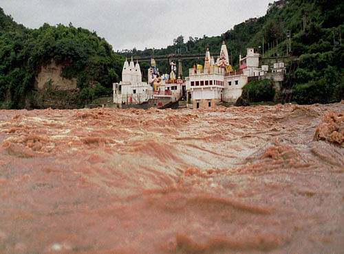 A view of Har ki Pauri temple, built near the banks of river Tawi during flash floods on the outskirts of Jammu on Sunday. PTI Photo