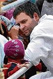 Congress General Secretary Rahul Gandhi interacts with the victims of floods at a relief camp at Choglamsar in Leh on Monday. PTI