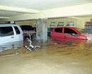 Neck deep mess: The basement of an apartment on K H Road was still flooded on Saturday after the overnight  torrential downpour. KPN
